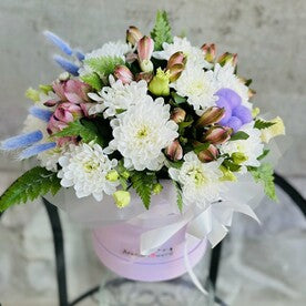 A composition with roses, eustoma, and chrysanthemum "Romance"