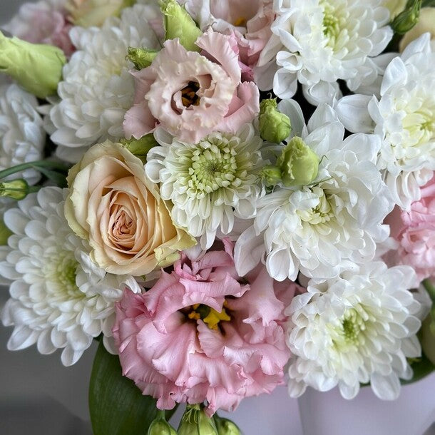 A composition with roses, eustoma, and chrysanthemum "Romance"